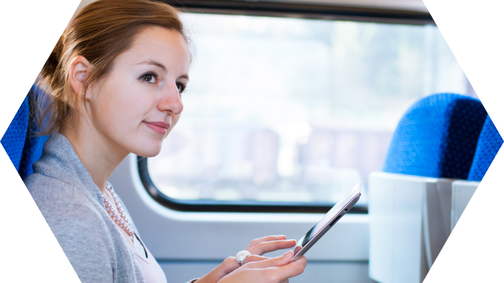 Lady using a tablet device on a train